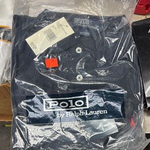 Polo by Ralph Lauren Men's Dark Blue Polo Shirt
Red emblem dead stock